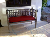 mexican bench with red cushion